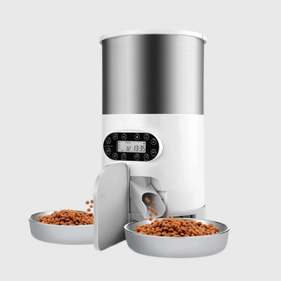 https://cdn.shopify.com/s/files/1/0763/9767/4819/files/Distributeur_de_croquettes_pour_chien_programmable_double_bols.png?v=1691154248