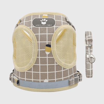 https://cdn.shopify.com/s/files/1/0763/9767/4819/files/Harnais_pour_chien_a_carreaux_jaune.png?v=1698685705