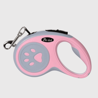 https://cdn.shopify.com/s/files/1/0763/9767/4819/files/Laisse_enrouleur_patte_de_chien_rose.png?v=1698852516