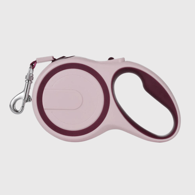 https://cdn.shopify.com/s/files/1/0763/9767/4819/files/Laisse_enrouleur_pour_chien_rose.png?v=1749046245