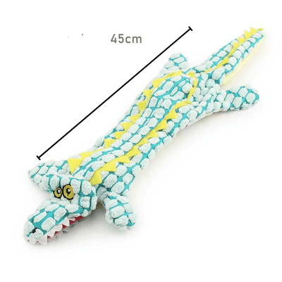 https://cdn.shopify.com/s/files/1/0763/9767/4819/files/Peluche_crocodile_pour_chien_carreaux.png?v=1753723108