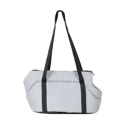 https://cdn.shopify.com/s/files/1/0647/9170/7830/files/sac-de-transport-pour-chien-en-voiture-4173268.webp?v=1777923130