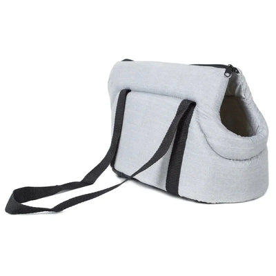 https://cdn.shopify.com/s/files/1/0647/9170/7830/files/sac-de-transport-pour-chien-en-voiture-9750319.webp?v=1777923131