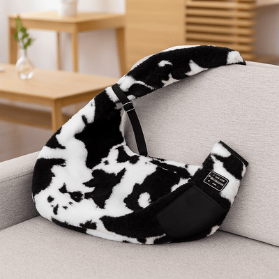 https://cdn.shopify.com/s/files/1/0647/9170/7830/files/sac-en-bandouliere-motif-vache-4176583.png?v=1777925120
